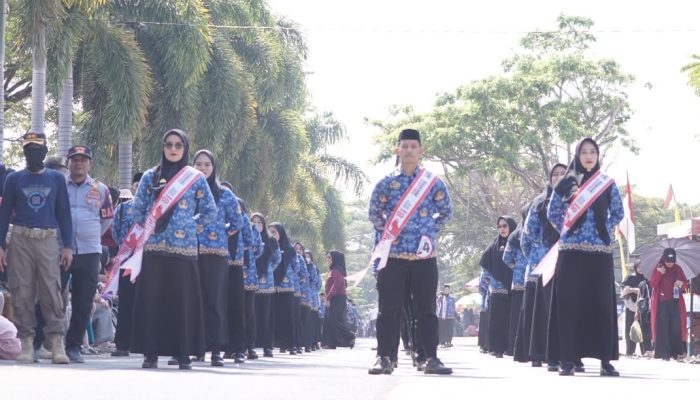 Meriahkan HUT ke-81 Kemerdekaan RI, Dinas Kominfo-SP Luwu Kompak Tampilkan Kebersamaan dan Disiplin Dalam Lomba Gerak Jalan Indah